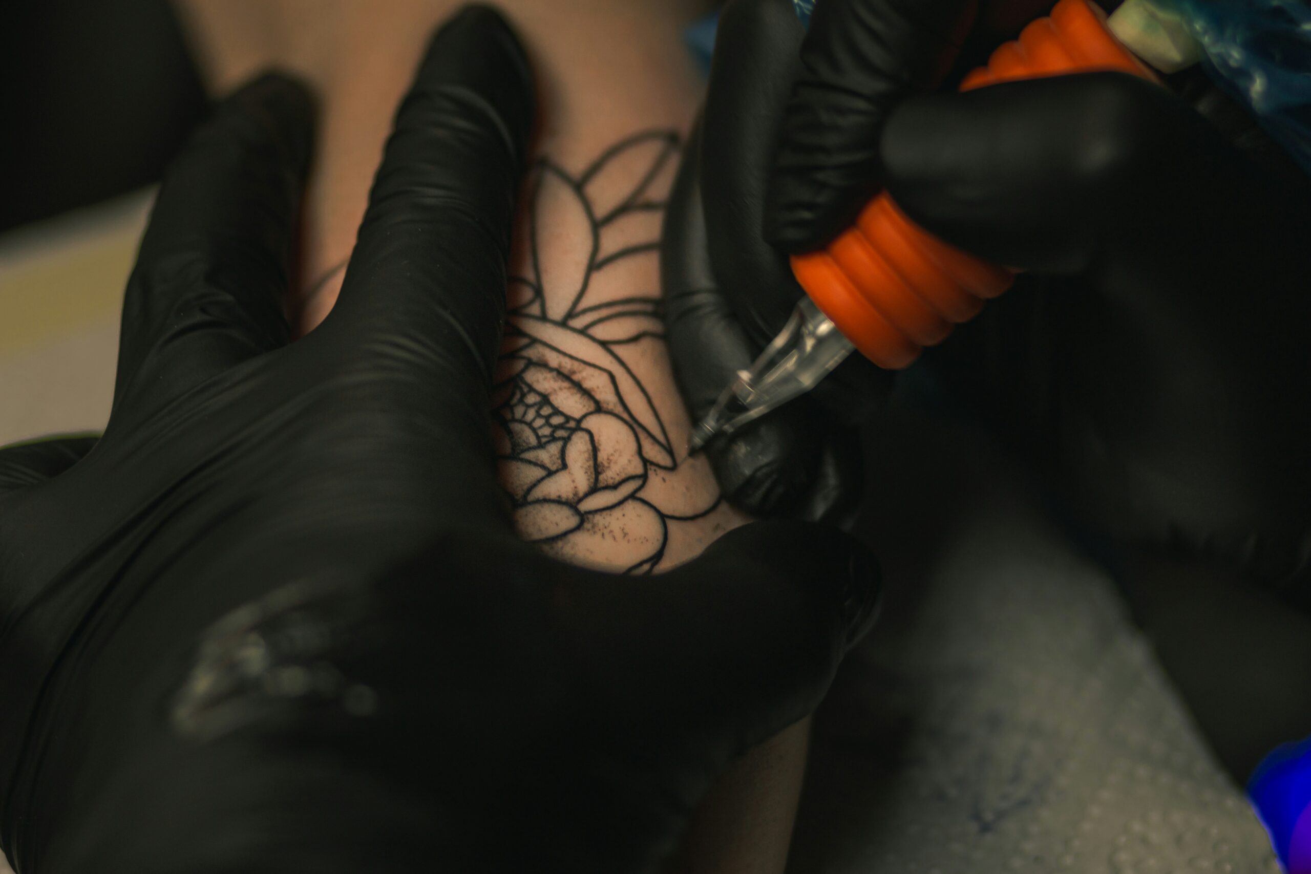 A close up of a tattoo being done