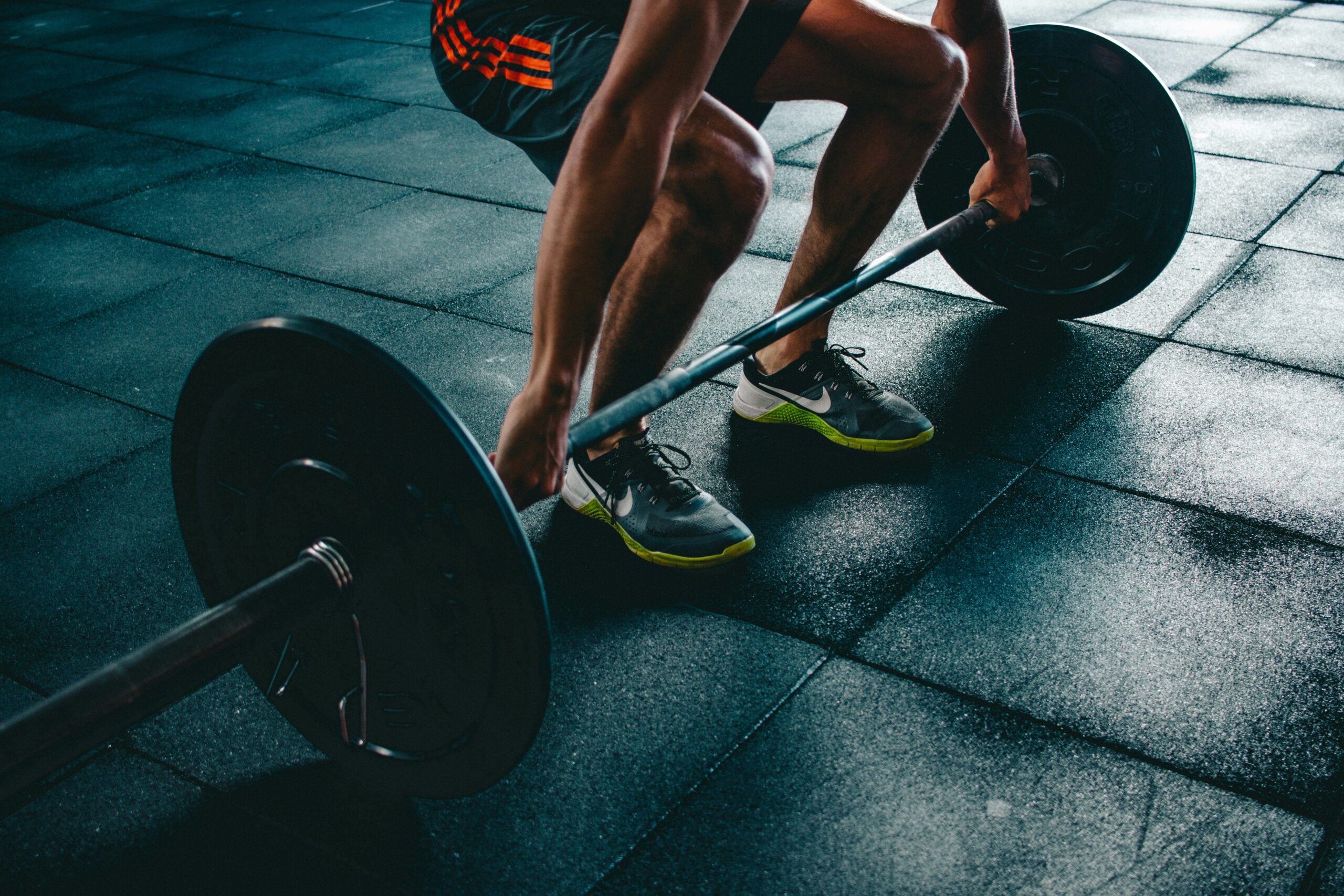 A person lifting weights with a barbell