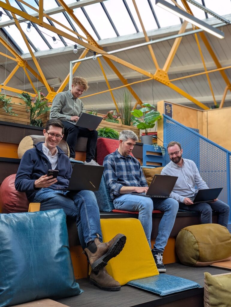 Image shows people working in a vibrant workspace